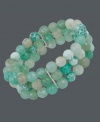 A taste of the tropics. Avalonia Road's destination-themed 3-row bracelet features pretty beads of green fire agate (55 ct. t.w.) with sterling silver accents. Bracelet stretches to fit wrist. Approximate length: 6-1/2 inches. Approximate width: 3/4 inch.