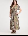 A spellbinding maxi dress featuring a vivacious print. The impeccably designed neckline will complement your decolletage as its Empire waist defines your shape.V-necklineShort sleevesEmpire waistAllover printConcealed back zipper About 43 from natural hem94% venezia/6% spandexDry cleanMade in USA