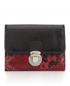 Vibrant red embossed snakeskin embellishes this chic wallet from Style&co., and the pushlock gives it a trendy snap.