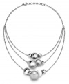 The possibilities are endless. Breil's chic stainless steel necklace can be worn in a variety of ways -- as a clustered statement necklace, as a subtle illusion necklace, or as a trendy station necklace. Polished and satin finish spheres and a white natural stone are easily moved to create the look of your choice. Approximate length: 18 inches.