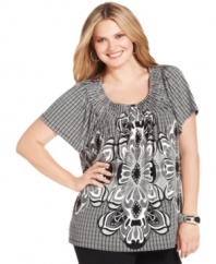 Make a lasting impression in Style&co.'s short sleeve plus size top, broadcasting a dramatic print.