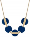 Feeling blue? Let this striking necklace cheer you up! Blue beaded circles create a unique effect on Kenneth Cole New York's frontal design. Set in gold tone mixed metal. Approximate length: 17 inches + 3-inch extender. Approximate drop: 1 inch.