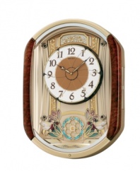Old fashioned charm and chimes, by Seiko. Melodies in Motion musical wall clock features brown burled finish. On the hour, clock plays one of twelve melodies selected from two sets. First set composed of six traditional melodies; second set composed of Christmas melodies. Dial opens in six segments to reveal six rotating fairies and rotating pendulum made with 28 crystallized Swarovski elements. Includes volume control, demonstration button and light sensor. Measures approximately 20-7/8 inches by 15-1/4 inches by 4-1/2 inches.