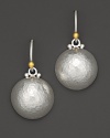 Gorgeous dome earrings crafted in hammered silver with 24 Kt. gold french wire backs.