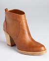 KORS Michael Kors ventures into the wild west with the Wayland booties, a pull-on bootie in rich, tanned leather.