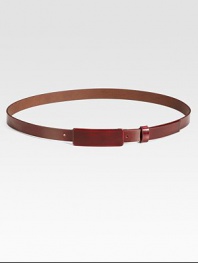 This thin leather style is finished with a small covered buckle tab.About 1 wideMade in Italy