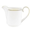 Rings of gold adorn fine white bone china with the lustrous shine of a wedding band. White bone china features two different border trims of gold, a wide corded border of textured grosgrain ribbon on some pieces, a narrow edge on others.