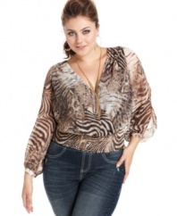Awaken your wild side with Baby Phat's long sleeve plus size top, featuring an animal-print.