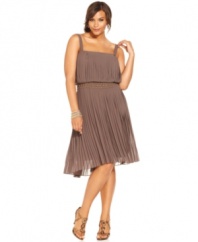 Nine West's plus size dress balances a flirty femme feel with a dose of daring thanks to its blouson-style bodice, pretty pleating and edgy studded waistband.