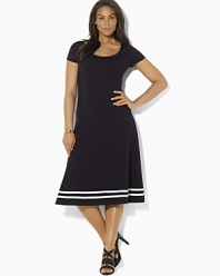 A timeless dress is rendered in a soft Pima cotton blend and finished with a flared skirt for a modern silhouette.