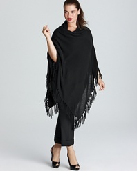 Transition into the new season by topping off your look with a lush layer. This C by Bloomingdale's Plus poncho is decorated by boho-chic fringe for the perfect touch of bohemian-chic.