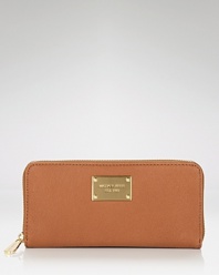 A chic zip-around wallet in luxe leather from MICHAEL Michael Kors.