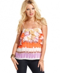 Soak-up some rays in this femme and colorful top from GUESS?, where a bodice of asymmetrical ruffles compliments a relaxed silhouette!