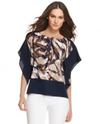 MICHAEL Michael Kors' kimono-sleeved petite top is stylishly striking with a printed center and solid sleeves and hemline. Pair with white pants to make the effect even more dramatic.