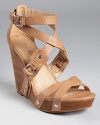 Decidedly edgy yet versatile, the Minda wedge is crafted in luxe, tumbled buffalo leather. From Via Spiga.
