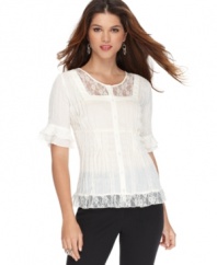 NY Collection gives us a frill! This petite lacy blouse looks just right for day or night.