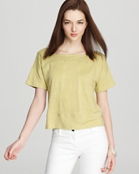 Popping with personality, this Eileen Fisher top infuses your wardrobe with youthful spirit as a cheery citrus hue springs from a studded silhouette.