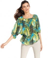 Bold mixed prints, delicate dolman sleeves and a trendy peplum waist take Alfani's petite peasant top to the next level in style! Pair with a variety of skirts, pants and jeans for a stunning outfit.