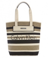 Wear with that breezy dress for rooftop cocktails or shorts and sandals by the beach, this every-occasion tote from Calvin Klein is the perfect companion. Dressed up in subtle stripes and discrete logo lettering for a look that's undecidedly delightful.