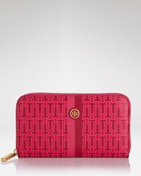 Tory Burch puts a bold spin on practical style with this logo-printed wallet. In durable coated canvas with room for the essentials, it's a modern girl's must have.