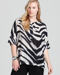 A vibrant blaze of zebra print lends exotic inspiration to this Lafayette 148 New York top. Punctuate the graphic silhouette with acid-bright accents and take charge of the fashion pack.