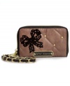 Stay organized on-the-go with this slim silhouette from Betsey Johnson that does double duty as a wallet and wristlet in one.  With glam hardware, posh pattern and plenty of interior compartments, it's no wonder this piece is absolute perfection.