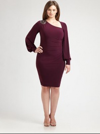 This sleek and sultry dress with a hint of stretch was made for your curves. Its alluring asymmetrical neckline is flawlessly complemented by a sparkling shoulder embellishment.Asymmetrical necklineBlouson sleevesBanded cuffsShoulder embellishmentConcealed back zipperFully linedAbout 25 from natural waist95% polyester/5% spandexDry cleanMade in USA of imported fabric