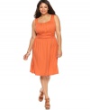 A ruched waist lends a sleek shape to AGB's sleeveless plus size dress-- dress it down for day and up for night!