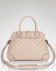 Marc Jacobs gives us a new reason to trade our usual slouchy styles for pretty polish. This structured satchel features quilted leather and a deceptively roomy shape for all of your cool girl (lady) essentials.