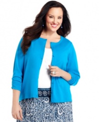 Add a classic layer to your casual outfits with Style&co.'s three-quarter sleeve plus size cardigan, accented by ruched cuffs.