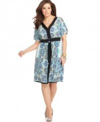 Solid border trim outlines NY Collection's short sleeve plus size dress, featuring a vivid print.