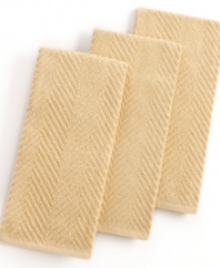 Grab style and keep function with a set of three kitchen towels that step forward in a calm color to wipe up spills, aid in prep and add an accent to your space. The textured design sets a sharp appearance for any room, while the highly absorbent terry quickly cleans up. Limited lifetime warranty.