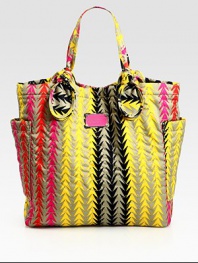 This vibrant carryall features signature letter stitching on printed nylon, complete with large over-sized pockets and knotted handles. Double top handles, 7½ dropMagnetic top closureTwo outside open pocketsOne inside zip pocketTwo inside open pocketsLogo-print lining14½W X 14½H X 4¼DImported