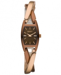 DKNY crafts a twist ending with this chic timepiece. Crafted of brown and rose-gold ion-plated stainless steel twist bracelet and rectangular case. Brown dial features rose-gold tone applied stick indices, crystal accents at three and nine o'clock, logo at twelve o'clock and rose-gold tone two hands. Quartz movement. Water resistant to 30 meters. Two-year warranty.