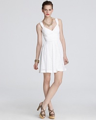 Fashioned in summer-perfect eyelet, this Shoshanna dress flaunts ladylike charm.