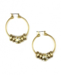A classic hoop style with a modern twist. Jones New York's chic earrings feature textured and smooth rondells in a gold tone mixed metal setting. Approximate diameter: 1/2 inch.
