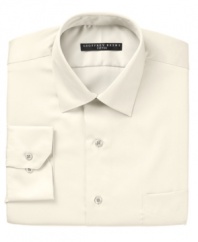Crafted in convenient wrinkle wash fabric and expertly tailored for the modern man, this fitted Geoffrey Beene dress shirt jump-starts any guy's workweek wardrobe.