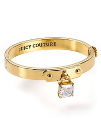 It's a lock. This simply-styled Juicy Couture bangle is a key addition to your arm party, cast in plated gold with a padlock charm.