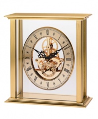 Watch as the gears shift inside this revealing tabletop clock by Bulova. A brass-finished metal frame houses a floating gold tone skeleton dial with black Roman numerals and two hands.