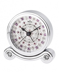 Sparkling crystals transform this bedside alarm clock from functional to fascinating. Chrome-finished metal case houses a white dial with hand-set pink and purple crystals and three black hands.