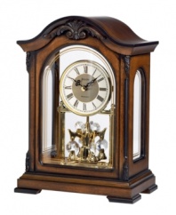 A timeless decorative accent, by Bulova. This solid wood mantel clock with an Old World walnut finish perfectly suits an office. Decoratively carved case with screened glass front and side panels and removable clear acrylic back houses a metal dial and revolving crystal pendulum. Plays Westminster melody on the hour.