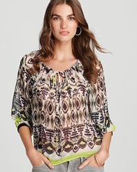 This vibrantly printed Sam & Lavi top makes an impact for summer but also transitions into fall with panache.