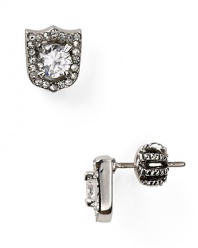 Crafted of plated metal, this pair of delicate studs earrings is fashion armor (or amour.)