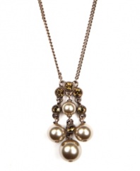 Lustrous mocha glass pearls are complemented by beautiful brown-hued crystals in this striking pendant  from Givenchy. Crafted in brown gold tone mixed metal. Approximate length: 16 inches + 2-inch extender. Approximate drop: 1-3/4 inches.
