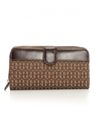 Get a hold of this: the elegant Annabelle clutch brings polish to your day with a signature logo weave and patent trim, and it's loaded with interior features to keep you organized.