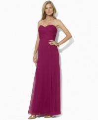 Exuding elegant glamour, the beautiful floor-grazing Lauren by Ralph Lauren gown is designed in lustrous georgette  with a crossover sweetheart neckline for feminine charm.