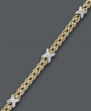 Two tone color for ultimate versatility. Crafted from 14k gold over sterling silver and sterling silver, this double row rope bracelet receives an extra-stylish touch with the addition of X-shaped accents. Approximate length: 7-1/2 inches.
