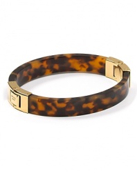 Classic cool. Wear MICHAEL Michael Kors' gold-hinged bangle to add burnished warmth to fall's cool looks.