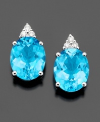 Brilliant blue gemstones are like a breath of fresh air on these gorgeous earrings featuring oval-cut blue topaz (5-1/2 ct. t.w.) and round-cut diamond (1/10 ct. t.w.) set in 14k white gold.