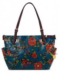 Flash some flower power with this take-anywhere silhouette from The Sak. Sturdy coated canvas is outfitted with shimmering hardware details and adjustable handles, while the roomy interior features plenty of pockets, making it the go-to silhouette of any season.